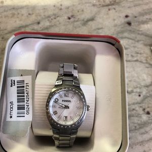 Fossil watch crystal surround with a shell face